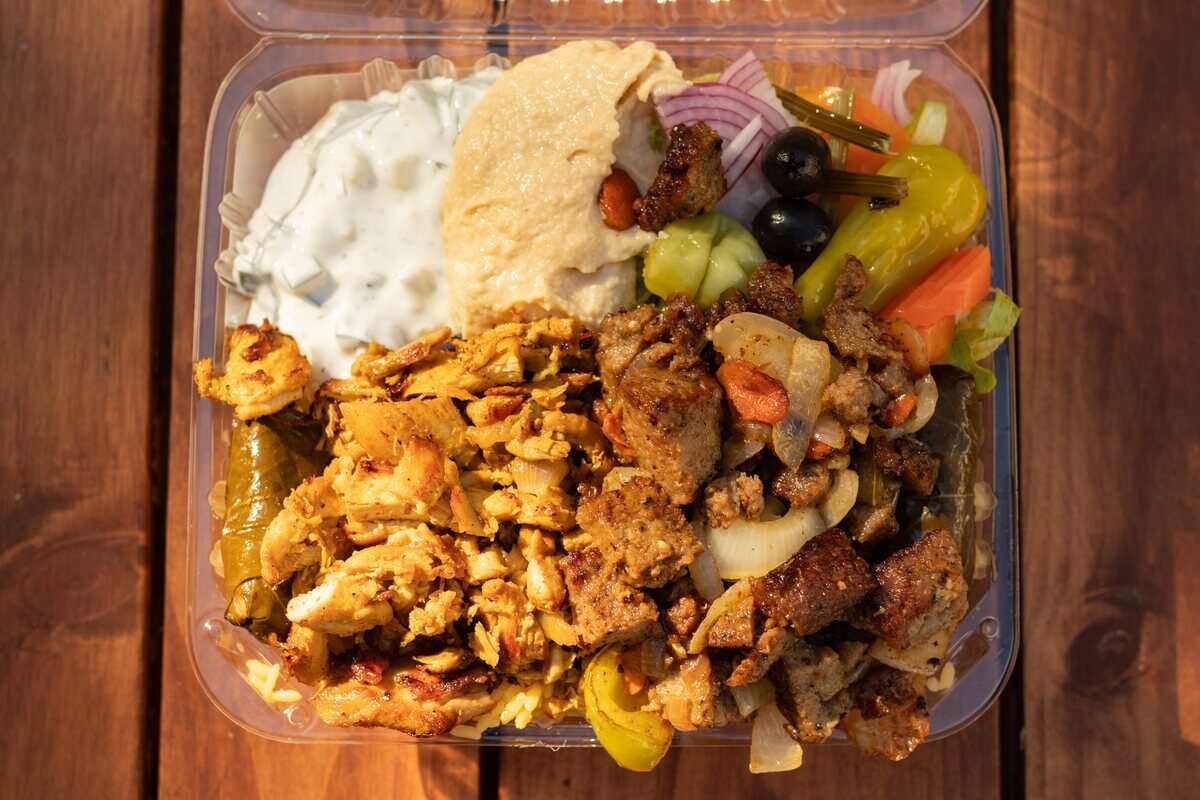 Chicken and lamb combo plate with rice and salad
