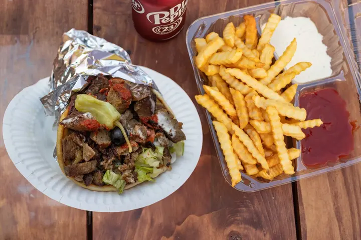 Lamb gyro meal with fries and a drink