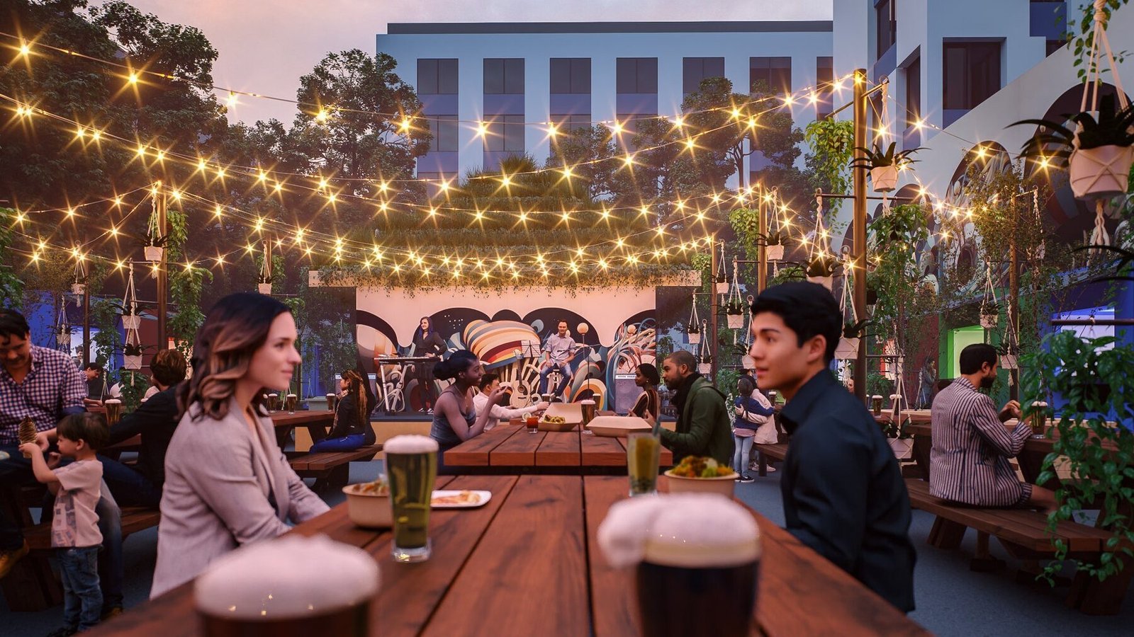 Guests dining under string lights at Midtown Beer Garden in downtown Portland